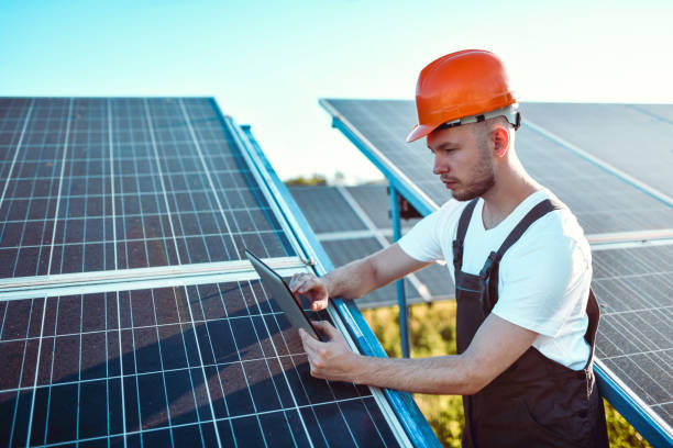 istock Bearded Engineer Checking Energy Production Rates Of Solar Panels Through Digital Tablet Software 1406950992