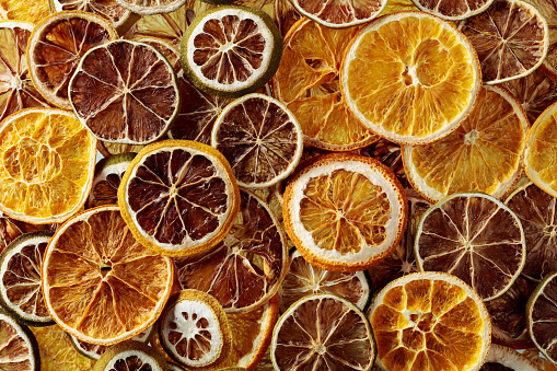 Dried citrus background. Dehydrated crispy fruit slices. Healthy meal snack. Top view.