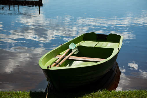 Shot of a young man relaxing on a kayak while fishing