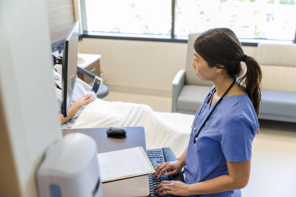 Free Stock Photo of Patient with doctor and nurse using computer ...