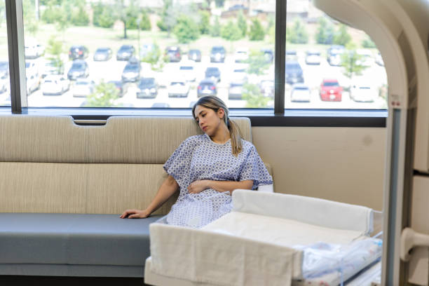 istock At hospital, exhausted young woman sits on sofa 1406956154