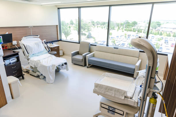 istock Empty room in obstetrics unit with bed and infant warmer 1406956161