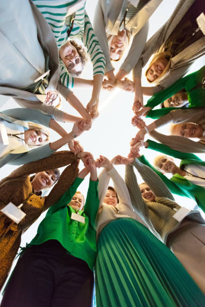 istock Women’s team. Group of women holding hands 1406956764