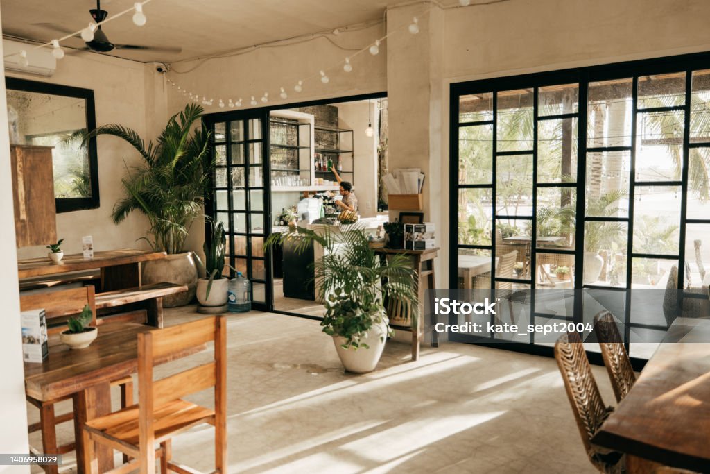 How to survive a recession: A guide for making the most of your money during a difficult time Small restaurant with no people inside Coffee Shop Stock Photo