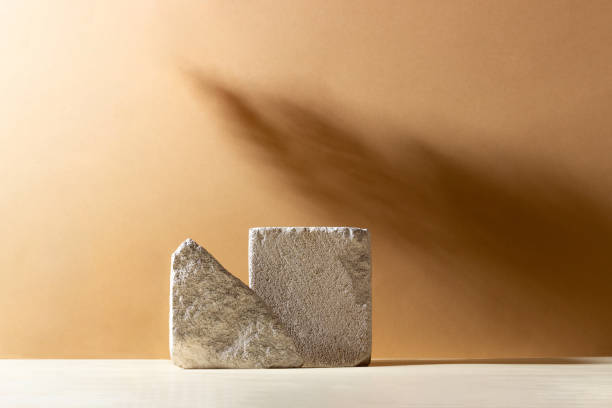 istock Background with geometric shapes made of concrete for cosmetic products. Rectangular podiums with shadows on a beige background. Blank mockup for product packaging presentation 1406962099