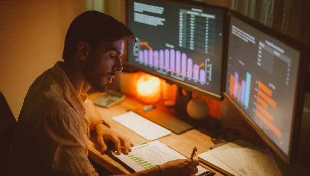 istock Businessman at home working late 1406965877
