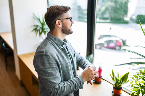 istock Businessman in Office Checking the Time 1406967034