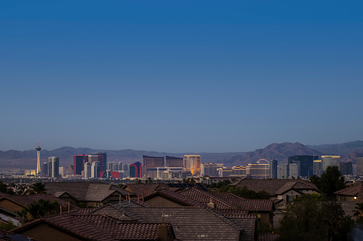 A view of the world famous Las Vegas Strip with homes in the foreground