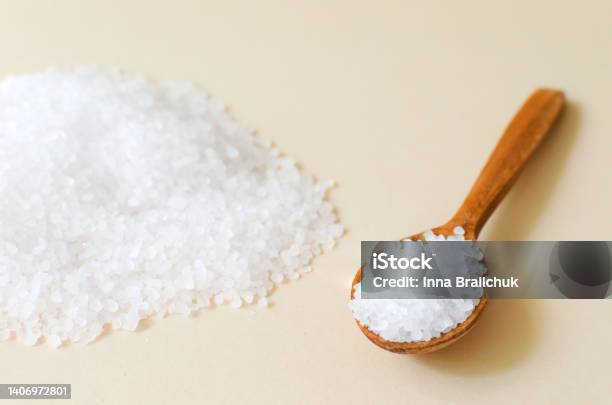 A Handful Of White Sea Salt With A Wooden Spoon Rough Texture Salt Is Suitable For Cooking And Beauty Treatments Horizontal Orientation Stock Photo - Download Image Now