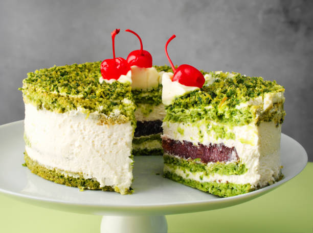 Vegan cake with green spinach and cherry