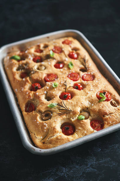 istock Focaccia Bread with Cherry Tomatoes, Olives and Rosemary 1406978953