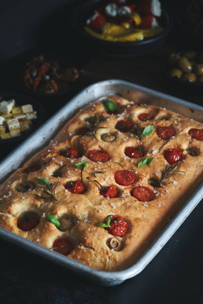 istock Focaccia Bread with Cherry Tomatoes, Olives and Rosemary 1406978974