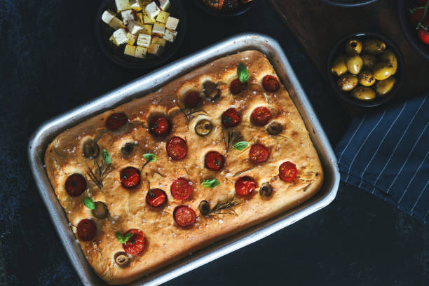 istock Focaccia Bread with Cherry Tomatoes, Olives and Rosemary 1406978988
