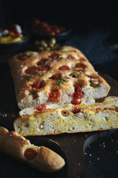 istock Focaccia Bread with Cherry Tomatoes, Olives and Rosemary 1406978990