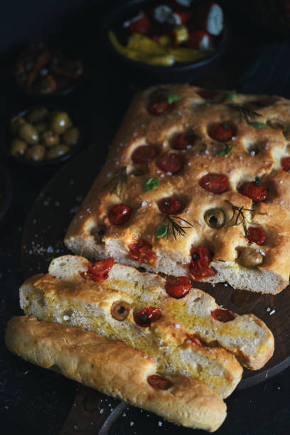istock Focaccia Bread with Cherry Tomatoes, Olives and Rosemary 1406979028