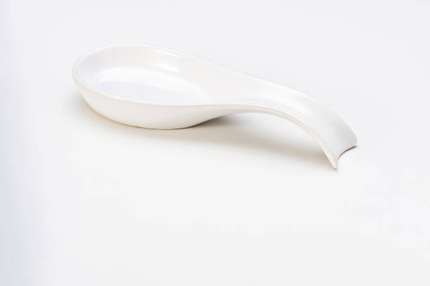 istock Modern simple white ceramic finger food spoon, isolated on white 1406981530