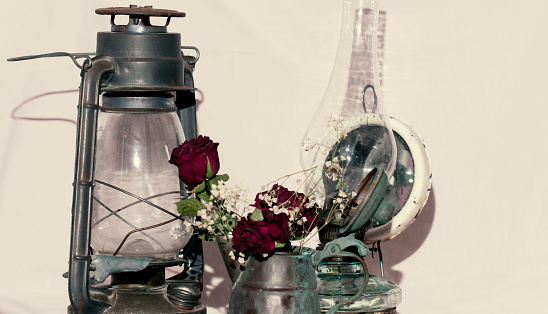 antique vintage kerosene lamp and copper jug, white background