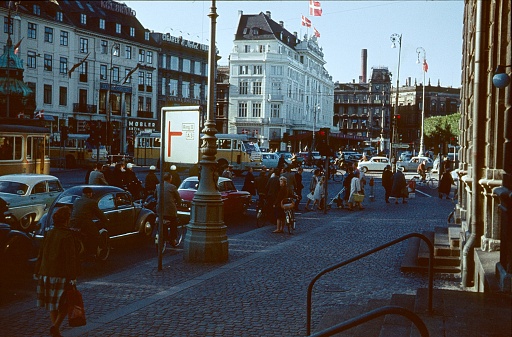 Copenhagen, Denmark, 1961. Street scene with pedestrians, road users, cars and buildings at an intersection in Copenhagen.