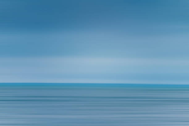 istock seascape abstract with panning motion combined with a long exposure. Image displays soft, pastel colors in a retro style. 1406989262