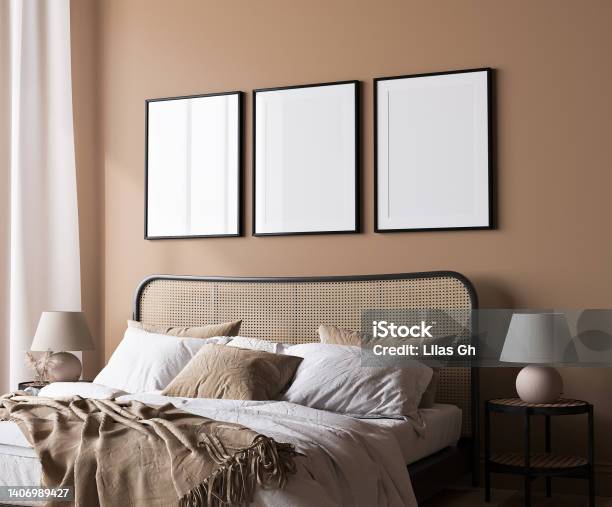 Bright Bedroom Mockup Rattan Wooden Bed In A Beige Background Poster Frame Mock Up Stock Photo - Download Image Now