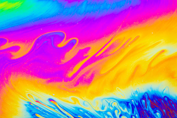 istock Psychedelic multicolored background abstract. Rainbow colors. patterns background. Photo macro shot of soap bubbles 1406989486