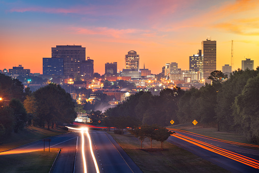 Columbia, South Carolina, USA downtown city skyline from above roadways at dawn.