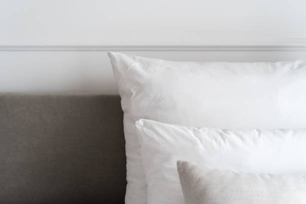 istock Hypoallergenic pillows on bed in hotel room 1406990554