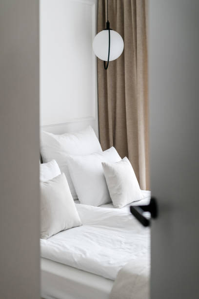 istock Contemporary hotel room interior design through open door 1406990561