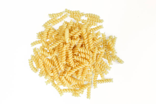 istock Uncooked spiral italian pasta. Fusilli isolated on white background 1406991289
