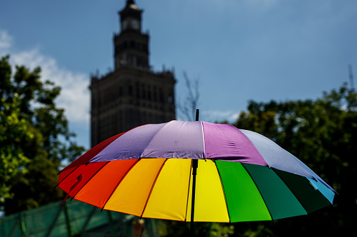 Rainbow umbrella in the city. Lgbt pride