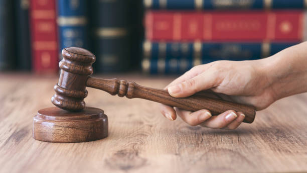Gavel of justice on books background stock photo