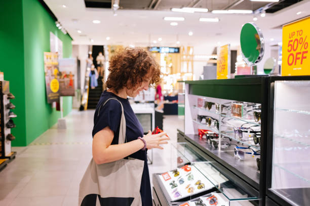 istock Woman Buying Sunglasses 1406993460