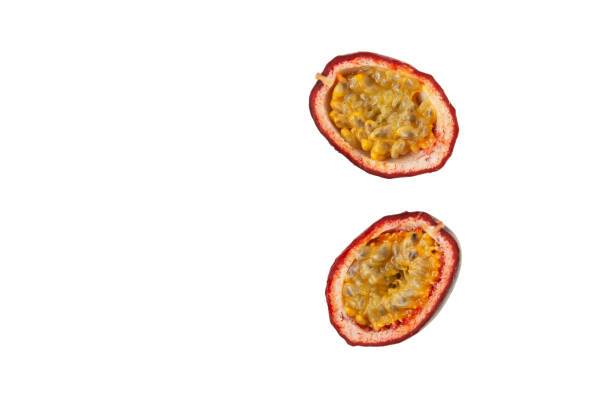 istock Halved passion fruit isolated on white background. Design element. Tropical fruit with delicious juicy pulp for preparing desserts and cocktails 1406994355