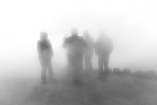group of people together in heavy fog in San Pedro de Atacama, Antofagasta, Chile