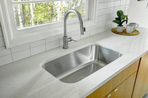 istock View of a renovated kitchen featuring a farmhouse style sink. 1406994561