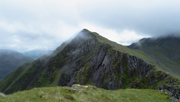 istock Along the Five Sisters Ridge in the Clouds 1406994962