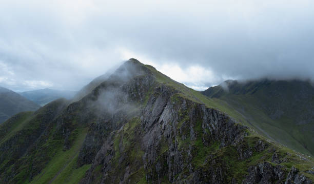 istock Along the Five Sisters Ridge in the Clouds 1406994977