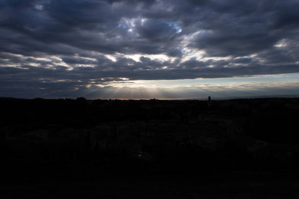 istock Dark sunset with lots of cumulonimbus, which make it impressive 1406995707