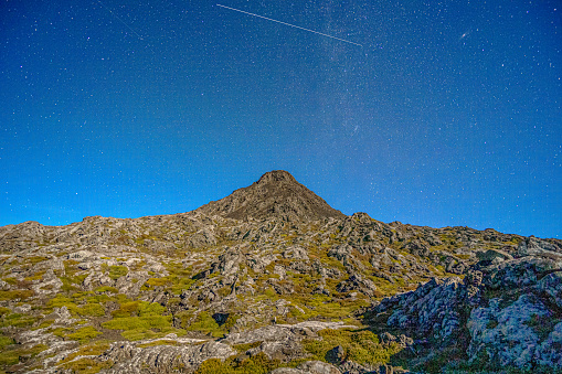 Piquinho, the highest mountain in Portugal.  Pico island in the Azores archipelago.  Night image with the passing of a shooting star.