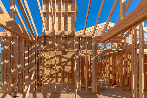 istock Home new wood frame stick built home under construction a blue sky 1406996060