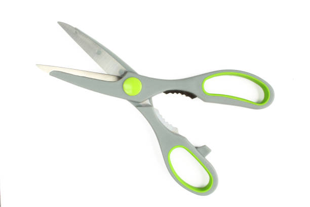 istock Grey and green kitchen scissors isolated on white background. For meat 1406996202