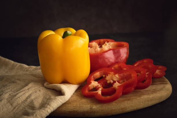 istock yellow and red peppers on the cutting board 1406996295