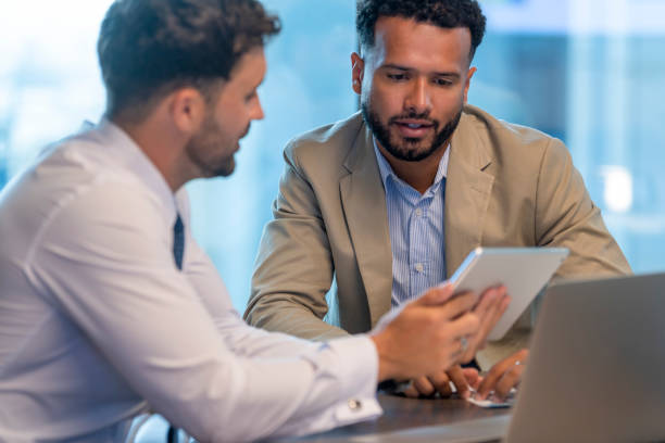 istock Business people working on a digital tablet. 1406998227