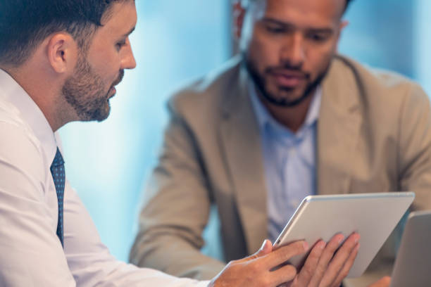 istock Business people working on a digital tablet. 1406998237