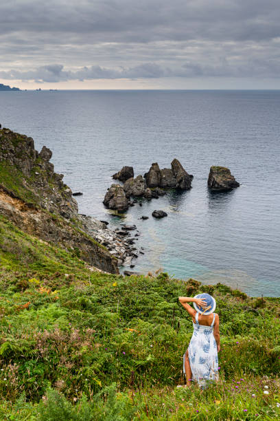 istock Woman at the Xuncos coast. 1406998404