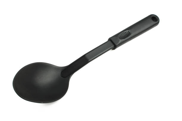 high angle view of metal spoon on white background