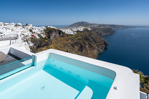 A hot tub in Santorini with a stunning view over the island, Greece