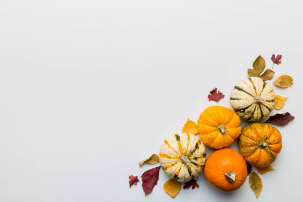 istock Autumn composition. Pattern made of dried leaves and other design accessories on table. Flat lay, top view 1407001386