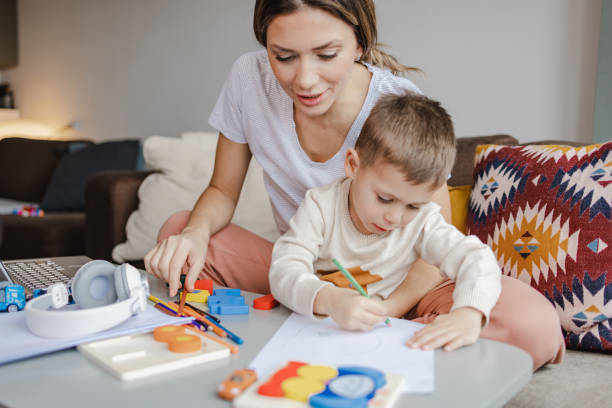 istock Creative little boy and his mother at home 1407002520