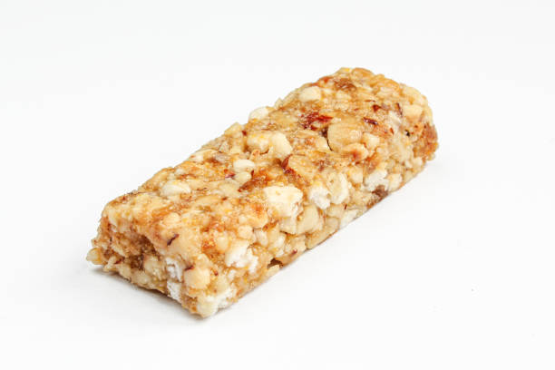 istock Single granola bar isolated on white background. Healthy food 1407003533